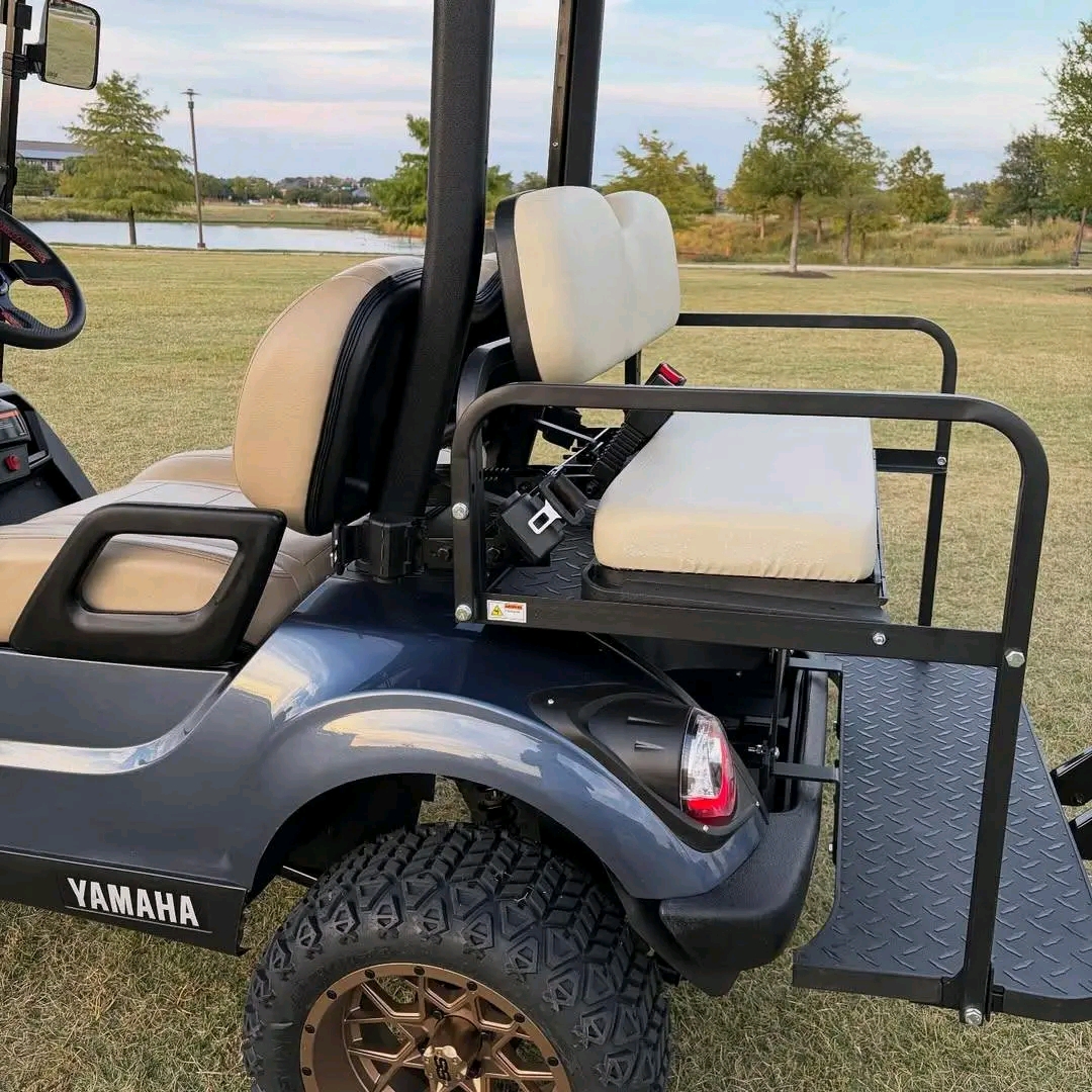 Yamaha Drive2 -custom-built with a lift kit, off-road tires on bronze/copper aftermarket wheels, tan diamond-stitched seating, dark gunmetal wrap, front cargo basket
