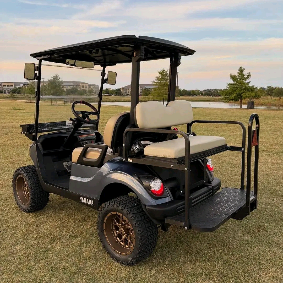 Yamaha Drive2 -custom-built with a lift kit, off-road tires on bronze/copper aftermarket wheels, tan diamond-stitched seating, dark gunmetal wrap, front cargo basket