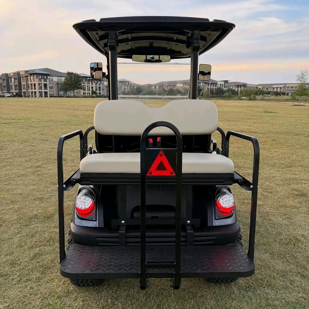 Yamaha Drive2 -custom-built with a lift kit, off-road tires on bronze/copper aftermarket wheels, tan diamond-stitched seating, dark gunmetal wrap, front cargo basket