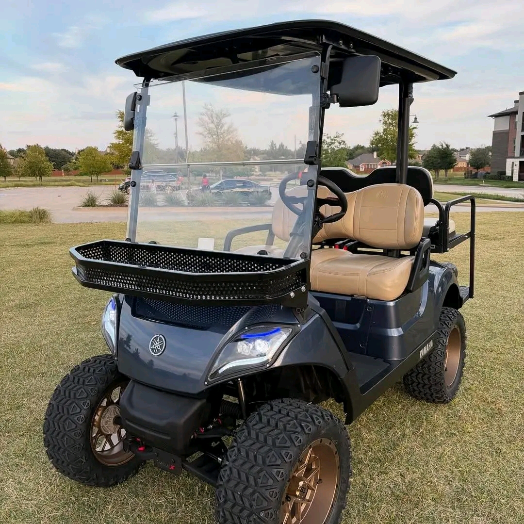 Yamaha Drive2 -custom-built with a lift kit, off-road tires on bronze/copper aftermarket wheels, tan diamond-stitched seating, dark gunmetal wrap, front cargo basket